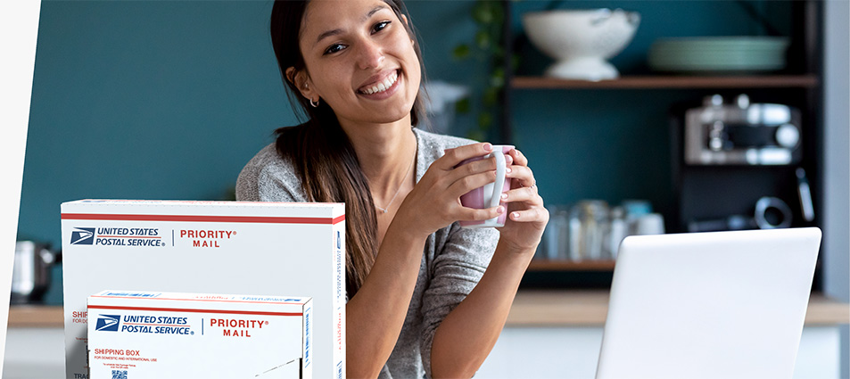 Woman sitting with coffee cup behind a Priority Mail box.